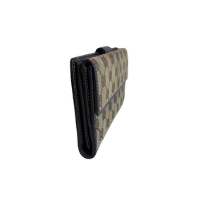 Right Side of Gucci Canvas Icon Bar Monogram Flap Wallet on a White Background.