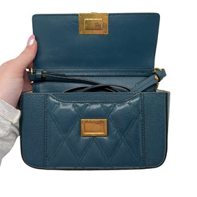 Givenchy Mini Pocket Pouch Bag  Teal Leather Exterior   Gold Toned Hardware   Teal Stitching on Exterior   Back Exterior Flat Pocket   Single Leather Teal Shoulder Strap   Gold Chain Exterior Accessory   Front Exterior Flap with Givenchy Emblem  Teal Leather Interior Front Flap   Tan Suede Interior   Single Interior Flat Pocket 