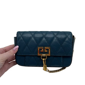 Givenchy Mini Pocket Pouch Bag  Teal Leather Exterior   Gold Toned Hardware   Teal Stitching on Exterior   Back Exterior Flat Pocket   Single Leather Teal Shoulder Strap   Gold Chain Exterior Accessory   Front Exterior Flap with Givenchy Emblem  Teal Leather Interior Front Flap   Tan Suede Interior   Single Interior Flat Pocket 