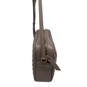 Saint Laurent Crossbody Bag Neutral Leather Gold-Tone Hardware Single Adjustable Shoulder Strap Tassel Accent Single Exterior Pocket Grosgrain Lining Single Exterior Pocket Zip Closure at Top