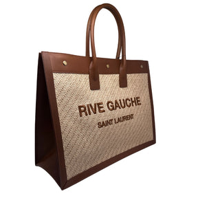 Rive Gauche Saint Laurent Tote Beige Exterior Leather Features Tubular Leather Handles Gold-Toned Buttons Three Snap Button Closures Brown Canvas Interior Hanging Pocket in Interior