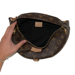 Louis Vuitton Bum Bag&nbsp;  LV Monogram&nbsp;  Gold-Toned Hardware&nbsp;  Flat Handle&nbsp;  Adjustable Waist&nbsp;  Leather Trim Embellishment&nbsp;  Single Exterior Pocket&nbsp;  Zip Closure at Front&nbsp;