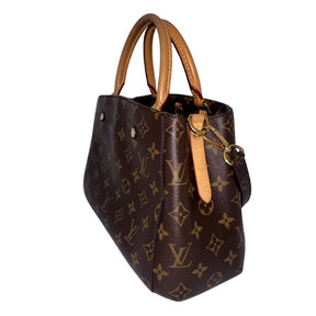 Louis Vuitton Montaigne BB&nbsp;  Brown Coated Canvas  Gold-Hardware  Leather Trim Embellishment&nbsp;  Rolled Handles&nbsp;  Single Shoulder Strap  Suede Lining&nbsp;  Interior Pockets  One Center Zip Pocket&nbsp;