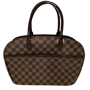 Louis Vuitton Damier Ebene Sarria Horizontal&nbsp;  Brown Coated Canvas  Damier Ebene Pattern  Gold-Toned Hardware  Leather Embellishments&nbsp;  Dual Rolled Handles  Suede Lining&nbsp;  Interior Pockets