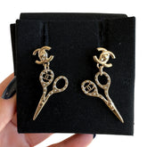 Chanel Crystal Scissor Earrings&nbsp;

Gold-Toned

Scissor Shape

Encrusted with Crystals&nbsp;