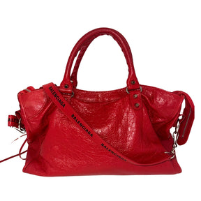 Balenciaga Motorcross City Bag&nbsp;

Red Exterior&nbsp;

Twiggy Model Bag

Zip Closure&nbsp;

Multiple Interior Pockets&nbsp;

Balenciaga Font Across Strap&nbsp;

Top Handles &amp; Adjustable Strap&nbsp;