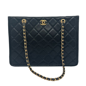 Chanel Quilted Tote Black Leather Interlocking CC Logo Gold Tone Hardware Chain-Link Handles & Chain Link Shoulder Straps Black Lining with Zip Pocket Exterior Pocket on Back Lock Closure on Top