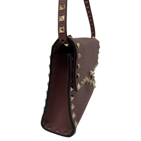 Valentino Stud Crossbody Deep Mauve Calf Leather Exterior Brown Suede Interior Gold-Toned Studs and Hardware Single Detachable Shoulder Strap Tonal Pyramid Studs Flip-Lock Closure at Front Flap Single Card Slot in Interior Dust Bag Included