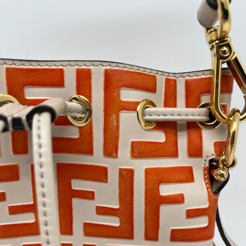 Fendi Embossed Zucca Mini Mon Tresor Bucket Bag, Tan and Red Calfskin Exterior, Zucca FF Logo, Silver Tone Hardware, Handle & Single Shoulder Strap, Alcantara Lining, Drawstring Closure at Top, Dust Bag Included, Condition: Good, Minor Scratching Pictured Above