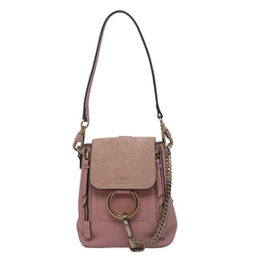 Chloe Mini Fae Leather Backpack  Pink Leather and Suede Exterior  Gold Tone Hardware  Chain Link Accent  Dual Exterior Pockets  Twill Lining  Dual Interior Pockets  Flap Closure at Front  Condition: Excellent