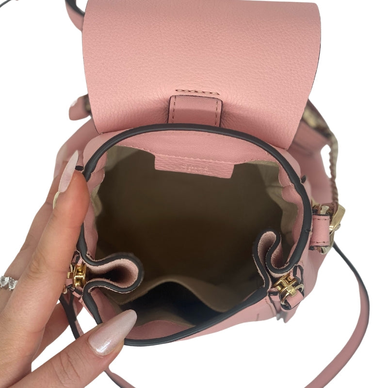 Chloe Mini Fae Leather Backpack  Pink Leather and Suede Exterior  Gold Tone Hardware  Chain Link Accent  Dual Exterior Pockets  Twill Lining  Dual Interior Pockets  Flap Closure at Front  Condition: Excellent