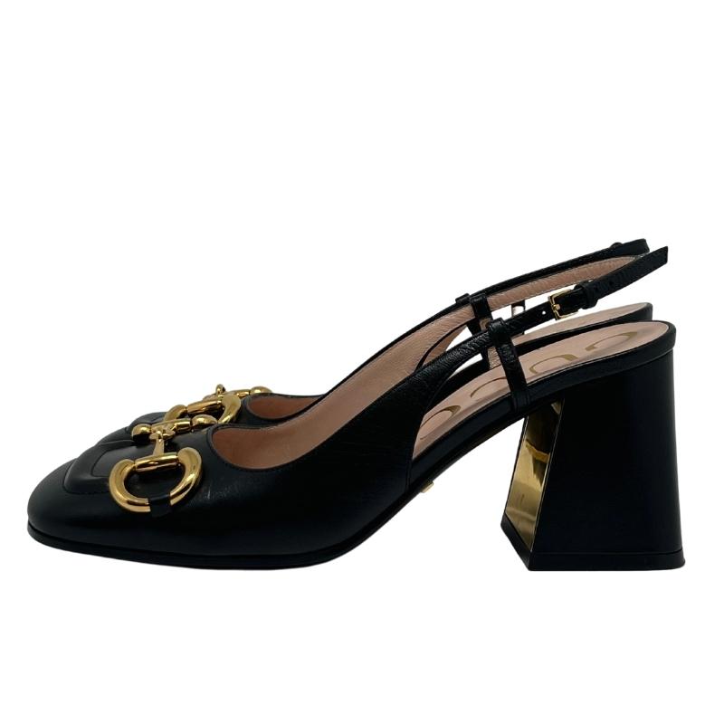 Gucci mid-heel slingback with horsebit, black leather exterior, gold horsebit hardware on front, gold on inside of heel, adjustable strap around ankle rounded toe, block heel, heel height 3", size 37, condition excellent