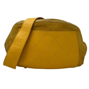 Front View: Yellow Suede Leather, Quilted Yellow Front Pocket, Leather Shoulder Strap, Gold Chain Link and Leather Waist Strap, Adjustable Buckle, Top Zipper Pocket, Chanel CC Zipper Pull. 
