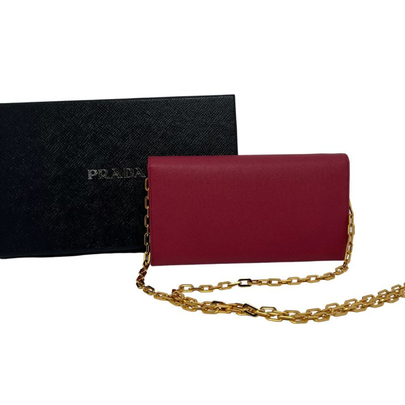 Prada Wallet on Chain with dark pink leather, gold tone hardware, chain link shoulder strap, interior pockets and card slots. Great condition