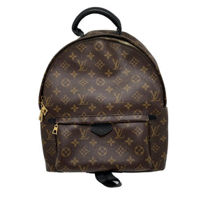 Louis Vuitton Monogram Palm Springs Backpack in monogram coated canvas with leather trim, brass hardware, single interior pocket, single exterior pocket, rolled handle, and dual adjustable shoulder straps. Excellent condition