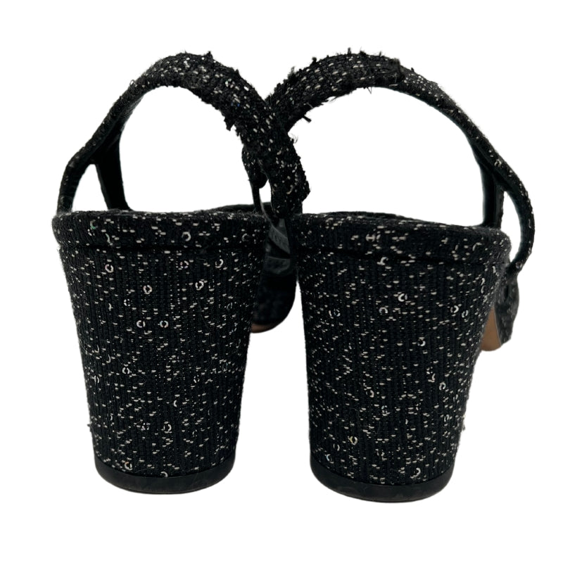 Back View: Black with Glitter Accents, Block Heel, Straps and Closure. 