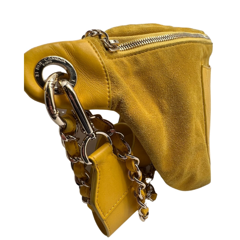 Side View: Yellow Suede Leather, Quilted Yellow Front Pocket, Leather Shoulder Strap, Gold Chain Link and Leather Waist Strap, Adjustable Buckle, Top Zipper Pocket.