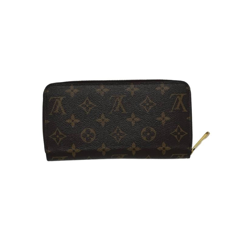 Louis Vuitton zipper wallet, brown lv logo coated canvas exterior, brass hardware, red leather interior, four interior pockets with card slots, exposed zipper closure, condition excellent, back view