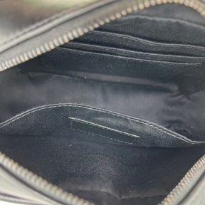 Saint Laurent Matelasse Lou Belt Bag in black leather with black tone hardware, single exterior pocket, single interior pocket and card slots, and adjustable waist strap. Excellent condition