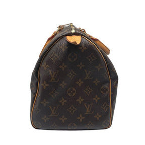 Louis Vuitton Monogram Speedy 35 Coated Canvas Exterior LV Monogram Brass Hardware Leather Trim Rolled Handles Canvas Lining Single Interior Pocket Zip Closure at Top Box and Dust Bag Included Condition: Excellent