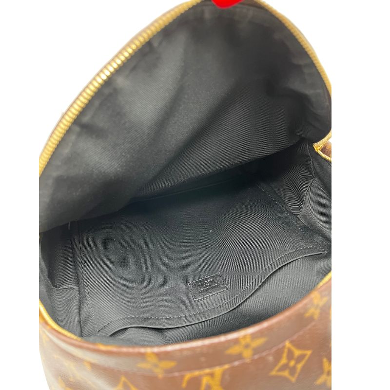 Louis Vuitton Monogram Palm Springs Backpack in monogram coated canvas with leather trim, brass hardware, single interior pocket, single exterior pocket, rolled handle, and dual adjustable shoulder straps. Excellent condition