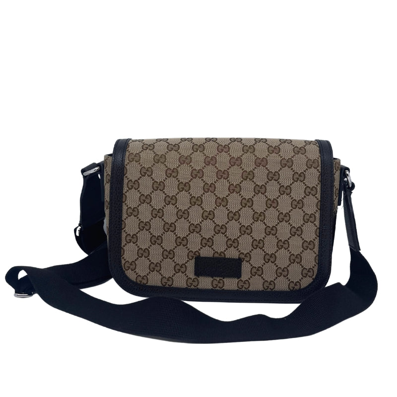 Gucci GG Canvas Messenger Flap Bag, Brown Canvas Exterior, GG Logo, Silver Tone Hardware, Single Adjustable Shoulder Strap, Leather Trim Embellishment, Canvas Lining, Three Interior Pockets, Snap Closure at Front
