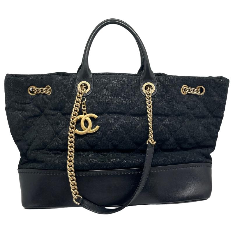 Chanel Caviar Quilted Globe Trotter Shopping Tote, Black Quilted Caviar Leather Exterior, Canvas Interior, Rolled Leather Handles, Gold Tone Hardware, Chain Link Strap, Three Interior Pockets, Snap Closure at Top, condition good