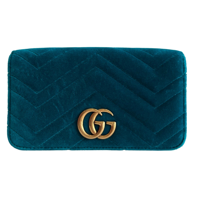 Front view: Gucci GG Marmont Velvet Crossbody Bag.  Teal Velvet .Gold Toned Hardware. Pink Canvas Lining.  Snap Closure at Front. 