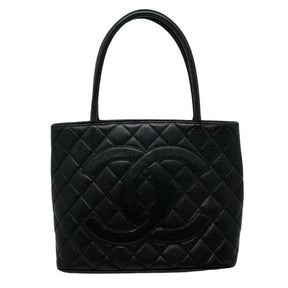 Chanel caviar medallion tote, black quilted caviar leather exterior, rolled dual handles, large cc logo at front, exterior pocket on back, silver hardware, top zip closure, dual interior pockets, leather lining, front view