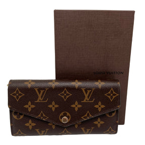 Front View: Monogram Canvas, Envelope Style Crossover Flap, Brass Snap, Box Included