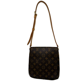 Front View: Louis Vuitton Monogram on Canvas, Brown Canvas Coated, Vachetta Leather Strap, Brass Hardware. 