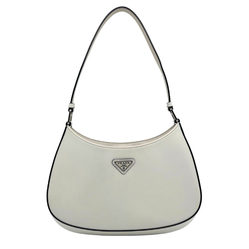 Prada Spazzolato Cleo Bag, White Leather Exterior, Silver-Tone Hardware, Single Shoulder Strap, Jacquard Lining, Single Interior Pocket, Snap Closure at Top, Condition: Excellent