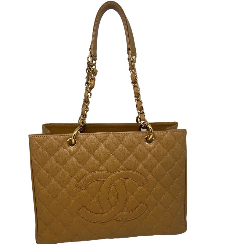 Chanel Caviar Grand Shopping Tote in neutral caviar leather with double CC logo, gold tone hardware, twill lining, single exterior pocket, three interior pockets. New with box
