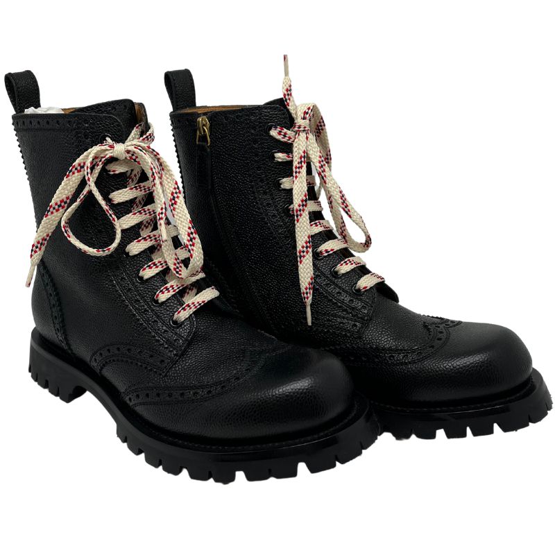 Gucci combat boots with black leather and rubber soles, laces and zippers on side. Excellent condition