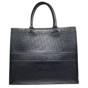 Dior leather oblique embossed book tote, black embossed dior logo exterior, christian dior across front, dual rolled handles, open top, suede lining, condition excellent, front view