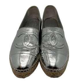 Front View: Silver Patent Leather, Interlocking CC Logo on the Toe. 