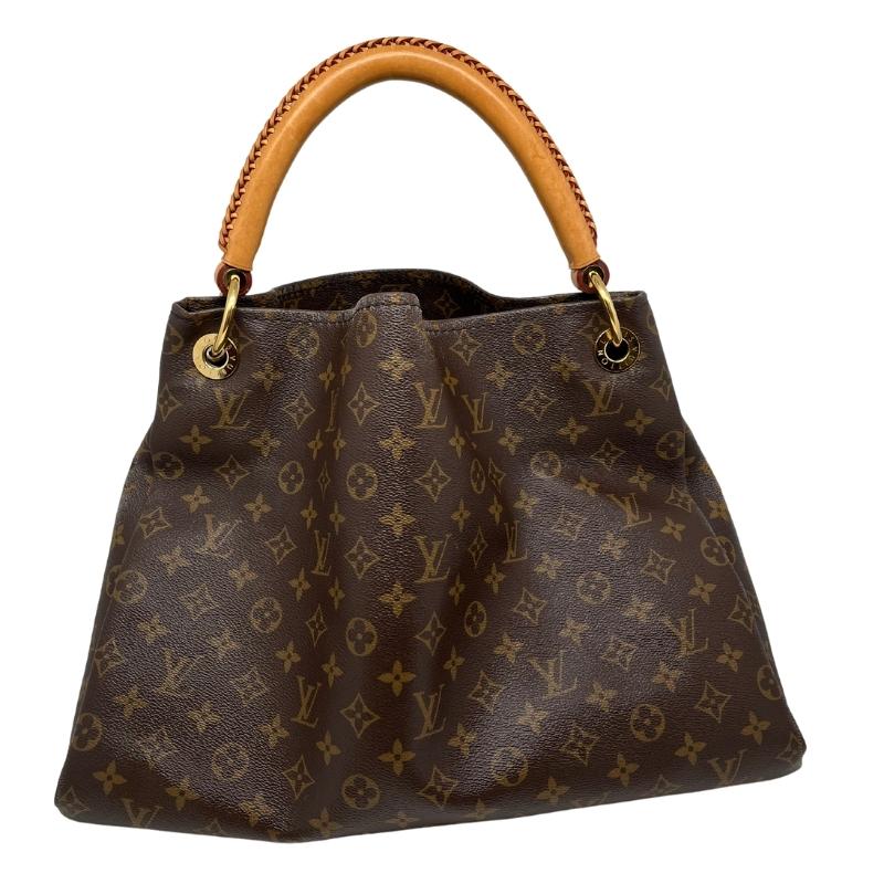 Louis Vuitton monogram artsy MM, brown LV logo coated canvas exterior, rolled handles, brass hardware, open top, alcantara lining, seven interior pockets, condition good, some distressing on sides, front view