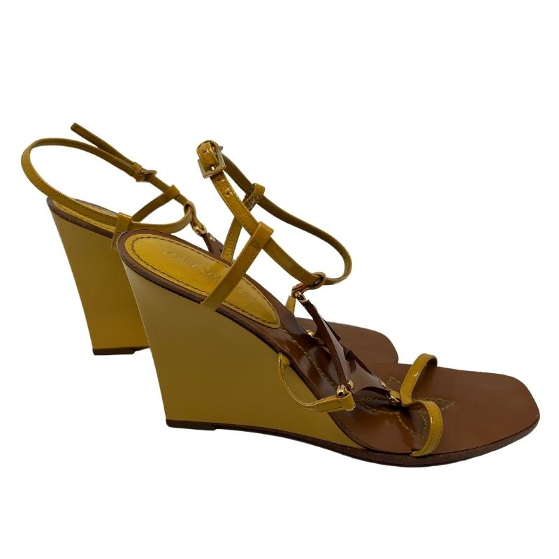 Louis Vuitton Wedge Sandals, Size: 38.5, Yellow Patent Leather, Tan Brown Leather, Fully Lined, Wedges Sandals, Flower Cut Outs, Buckle Closure, Leather Soles and Insoles, Heel Height: 10". Condition: Excellent.