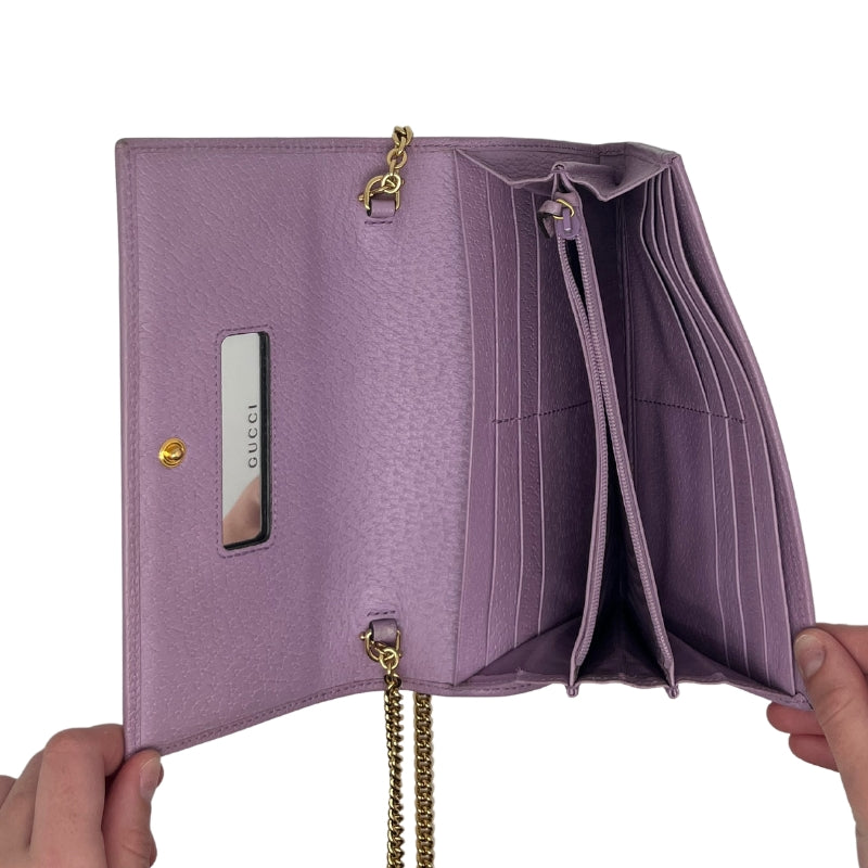 Gucci Flora Wallet on Chain Lavender Leather Exterior Printed Flora Pattern GG Logo Gold Tone HardWare Front Flap Snap Closure Chain Crossbody Strap Leather Lining Interior Zip Pocket Box Included Condition: Excellent