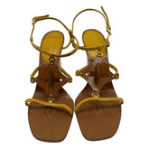 Louis Vuitton Wedge Sandals, Size: 38.5, Yellow Patent Leather, Tan Brown Leather, Fully Lined, Wedges Sandals, Flower Cut Outs, Buckle Closure, Leather Soles and Insoles, Heel Height: 10". Condition: Excellent. 