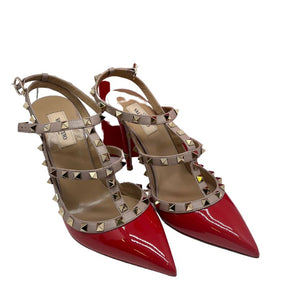 Valentino Rockstud Patent Leather T-Strap Pumps with red patent leather, nude trim, rockstud accents, pointed toe, stiletto heels, buckle closure. Excellent condition, size 40