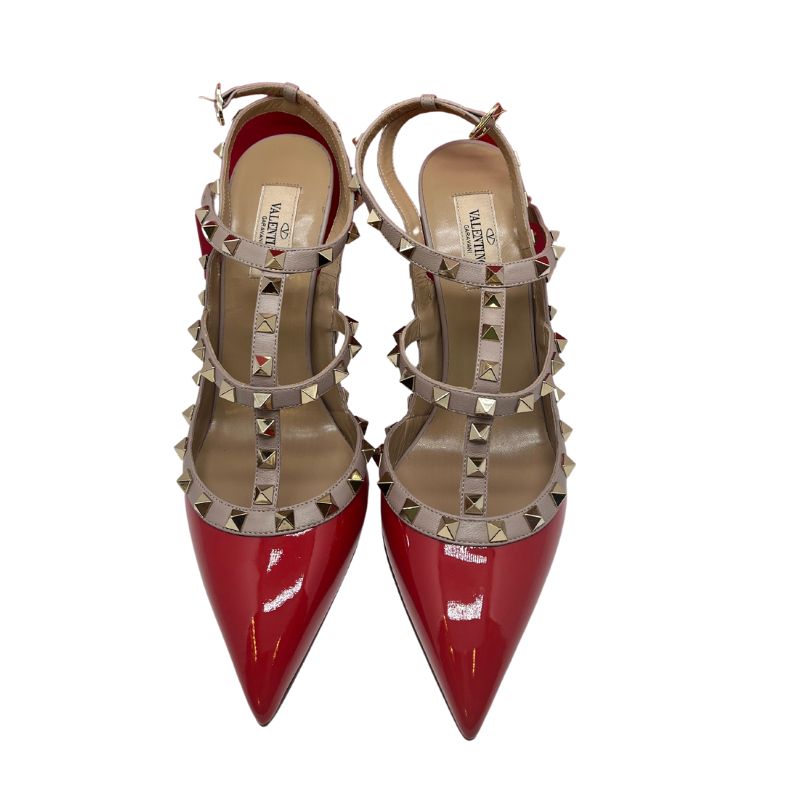 Valentino Rockstud Patent Leather T-Strap Pumps with red patent leather, nude trim, rockstud accents, pointed toe, stiletto heels, buckle closure. Excellent condition, size 40