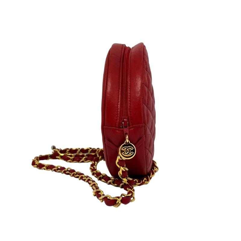 Chanel Round Red Chain Bag, Red Leather Exterior, Interlocking CC Logo, Chain Link Accent, Gold Tone Hardware, Grosgrain Lining, Zip Closure at Top, Single Interior Pocket, Condition: Excellent
