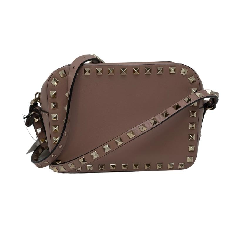 Valentino rockstud crossbody bag, taupe leather exterior, gold hardware, studs around trim, single adjustable studded shoulder strap, top zip closure, single interior pocket, canvas lining, condition excellent, back view