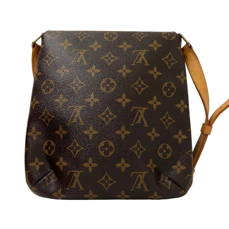Back View: Louis Vuitton Monogram on Canvas, Brown Canvas Coated, Vachetta Leather Strap, Brass Hardware. 