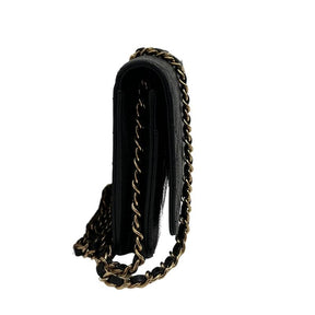 Chanel caviar wallet on chain, gold toned hardware, black quilted caviar leather, chain shoulder snap, single exterior pocket, dual interior pockets with card slots, flap closure at front, condition excellent, side view