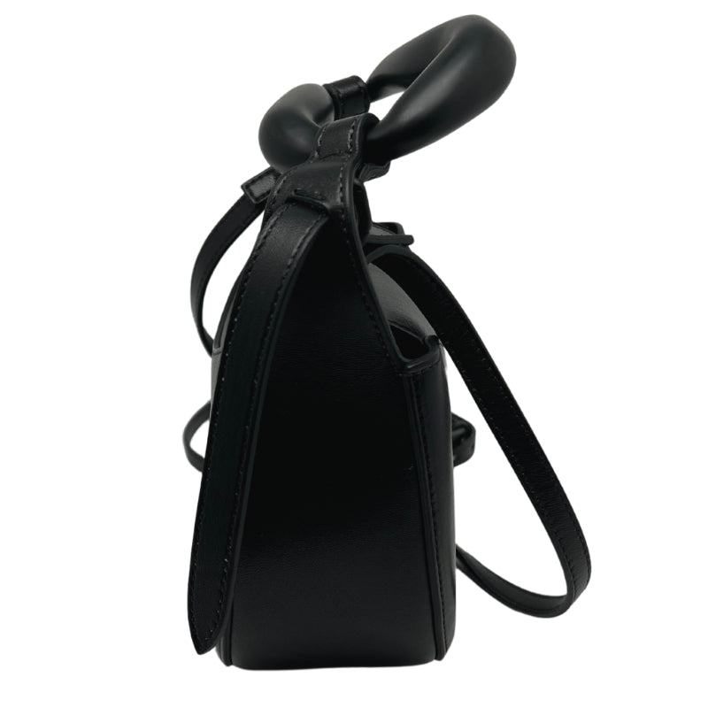 Side View: Black Leather, Black-Tone Hardware, Top Handle.