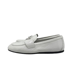 Prada white patent leather loafers, gold and white metal prada logo on front, white patent leather exterior, szie 38, rubber sole, penny loafer style, condition good with some exterior scuffs