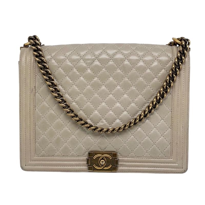 Chanel Grey XL Boy Bag, Grey Leather Exterior, Interlocking CC Logo, Quilted Pattern, Silver Tone Hardware, Chain Link Shoulder Strap, Canvas Lining, Three Interior Pockets, Push Lock Closure at Front, Condition: Excellent