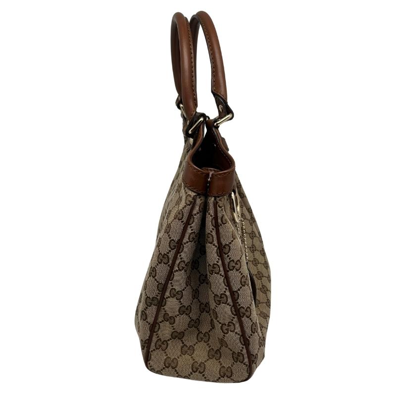  Gucci GG Canvas Sukey Tote, GG Canvas, Dark Brown Leather Trim, Gold-Tone Hardware, Two Leather Top Handles, Magnetic Snap Closure. Condition: Excellent.